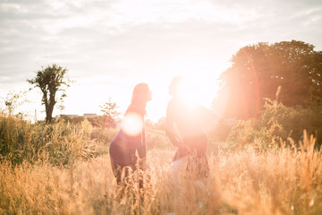 Mom with daughter  walking in the field