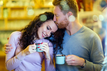 Romantic couple having date in coffee shop
