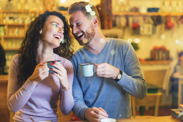 Romantic couple having date in coffee shop