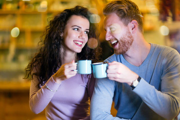 Romantic couple having date in coffee shop