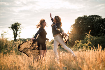 Mom with daughter  walking in the field