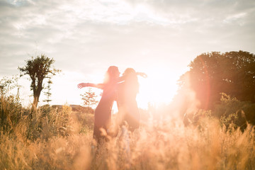 Mom with daughter  walking in the field