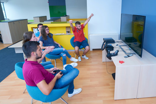 Young Group Relaxing At Co Working Space