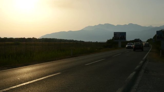 Cars traffic on the mountain road. Cars moving on the raod
