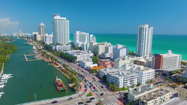 MIAMI, FL - FEBRUARY 2016: Aerial view of Miami Beach buildings along the river. Miami attracts 15 million tourists annually.