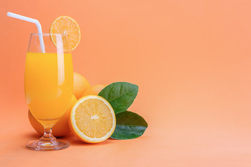 Orange juice in glass and fresh citrus around  on wooden table background fruit product display or montage