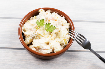 Typical dish of spain, russian salad with fork. Mediterranean diet.