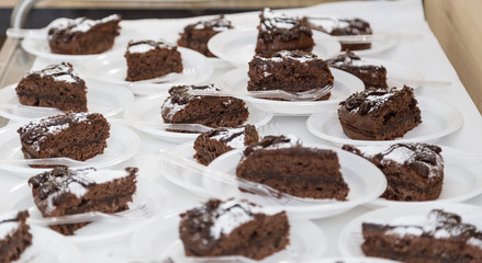 Chocolate cake in a plate during a village feast