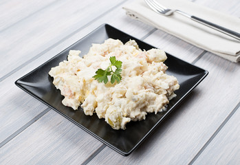 Typical dish of spain, russian salad with fork. Mediterranean diet.