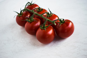 Cherry tomatoes isolated over white background