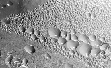 abstract background of drops on gray glass