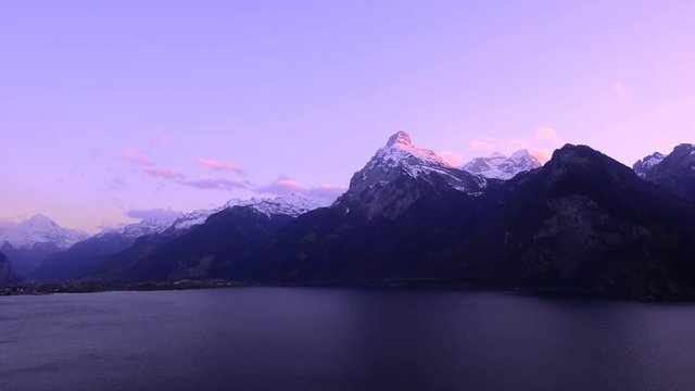 A mountain range in the canton of Uri. Switzerland. Lake Lucerne.In the romantic pink of the setting sun. Oberbauenstock (2116m), Niderbauen-Chulm. Left Bristen 3073m