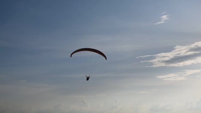 Paragliding flying in the blue sky,Phuket,Thailand.