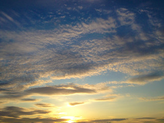 Naklejka na ściany i meble Evening sky. Beautiful clouds at sunset.