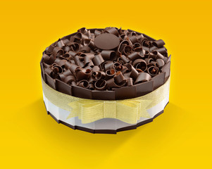 Chocolate cake with chocolate ship topping on yellow background.