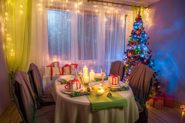 Traditionally Christmas table setting during the frosty winter evening