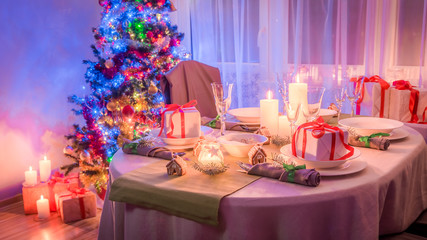 Gorgeous Christmas table setting with tree and present