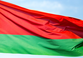 Naklejka premium Flag of Belarus against the blue sky