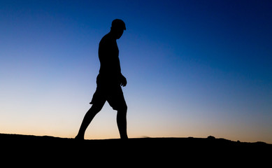 Silhouette of a man at sunset