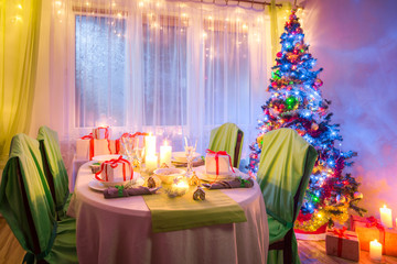 Christmas table setting with Christmas tree and gifts