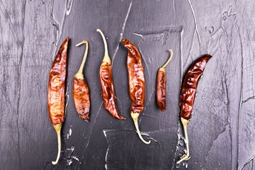 Set peppers on a dark background