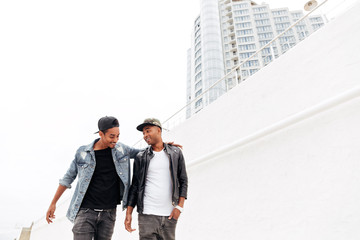 African men friends walking outdoors