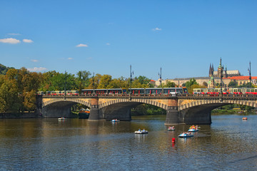 Fototapeta premium Prague, The Czech Republic: AUGUST 23, 2017- Traffic Jam of the trams on the Legii Bridge on sunny summer day. Prague. Czech Republic