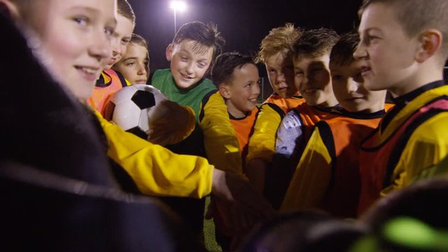 March 2016. British youth soccer team training huddle for a team talk