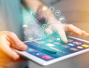 Home button of a technology interface surrounded by application - technology app concept