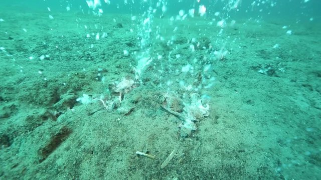 Hot water bubbles, rising from underwater volcano on ocean floor at Pulau Weh, Indonesia 
