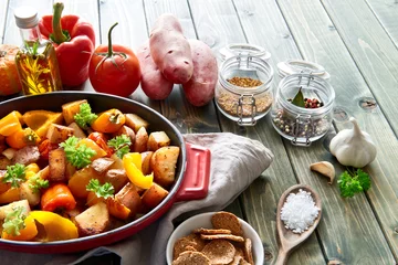 Aluminium Prints meal dishes Rustic, oven baked vegetables with spices and herbs in baking dish