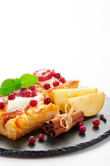 Apple cake with cream, jam and forest berries