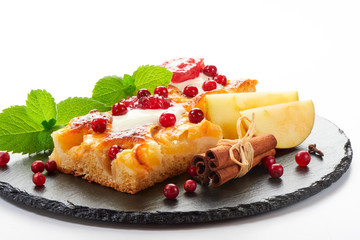 Apple cake with cream, jam and forest berries