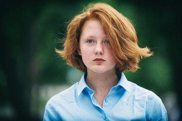 portrait of a sad redhead teenage girl