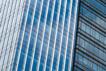 Obraz premium background of the glass modern office building.