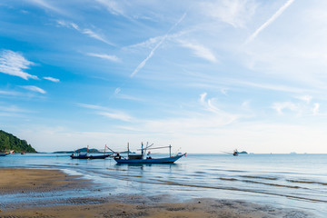 Fototapeta na wymiar Traditional fishing boat on the beach with blue sky