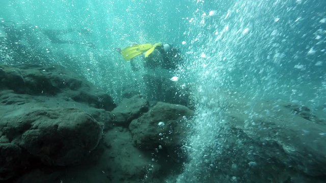 Scuba diving among hot bubbles from underwater volcano, Pulau Weh, Aceh, Indonesia 