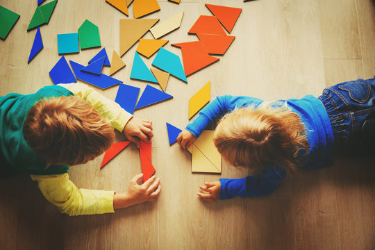 kids playing with puzzle, education concept
