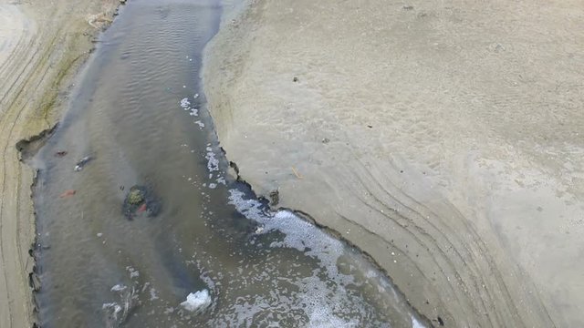 community drain waste water to sea beach 