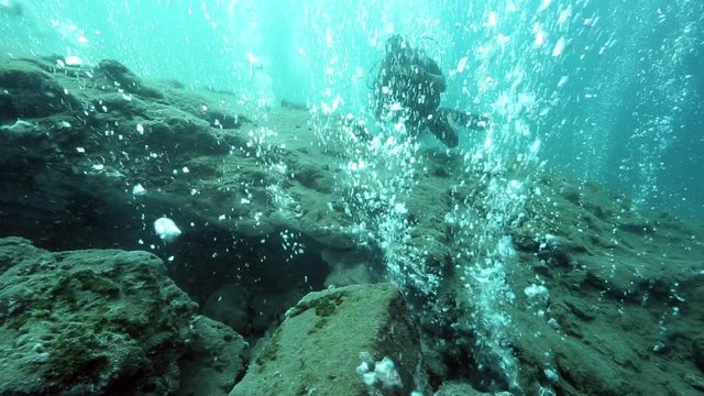 Scuba diving among hot bubbles from underwater volcano, Pulau Weh, Aceh, Indonesia 