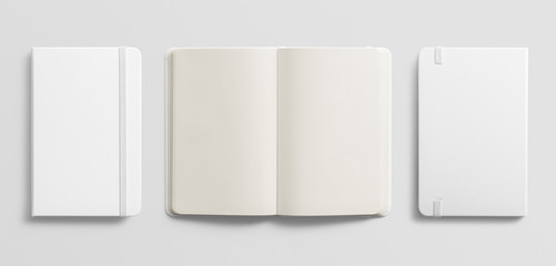 Blank photorealistic notebook mockup on light grey background.