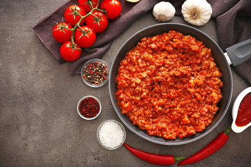 Meat sauce in frying pan on kitchen table