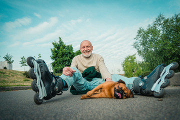 Grandpa rolls on roller with a dog of the Gryphon breed