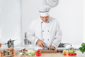 Male chef cooking in kitchen