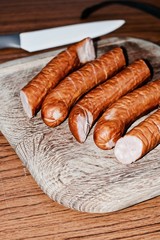 Delicious sausage on the wooden board
