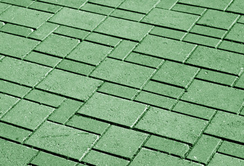 green color pavement pattern with blur effect.