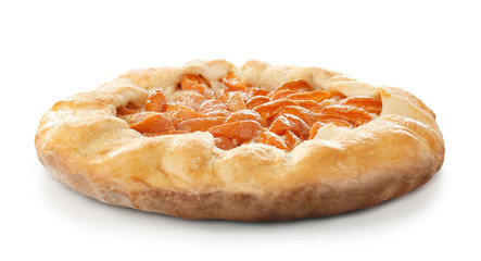 Delicious apricot cake on white background