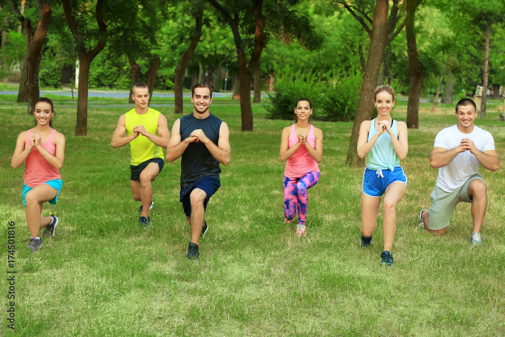 Poster group of young people doing exercise outdoors