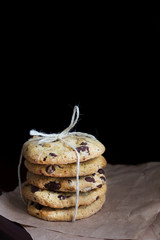 A Pile of Chocolate Chip Cookies on the Black Background