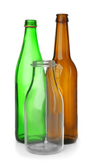 Empty glass bottles on white background